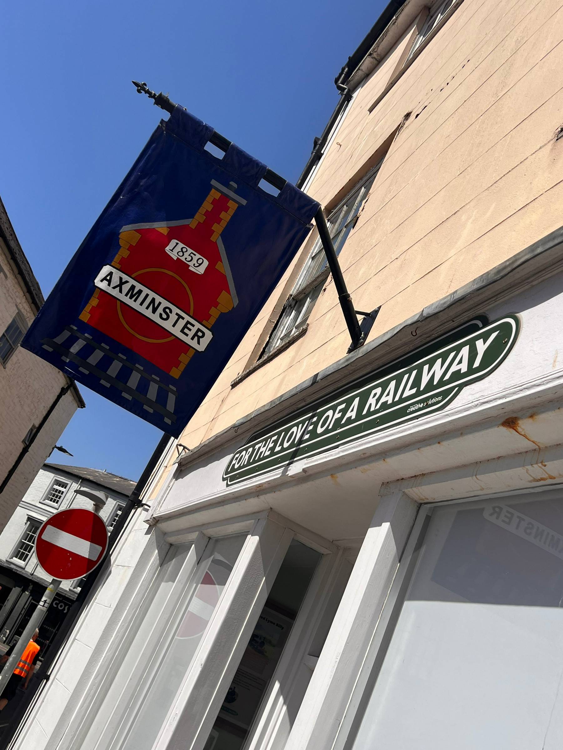 Two banners mounted above Lou La Belle in Axminster